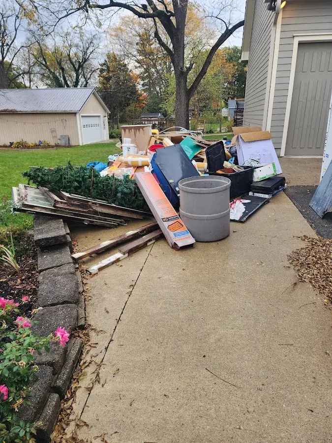 Dumpster being loaded with debris for Residential Dumpster Rental in East Orange